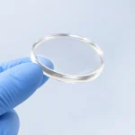 Suresult sterile ultrasound gel pad held in a gloved hand