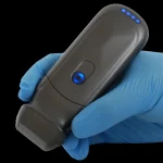 Suresult PD2 phased-array probe in a clinician's gloved hand