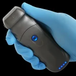 Suresult PD2 phased-array probe held in a gloved hand